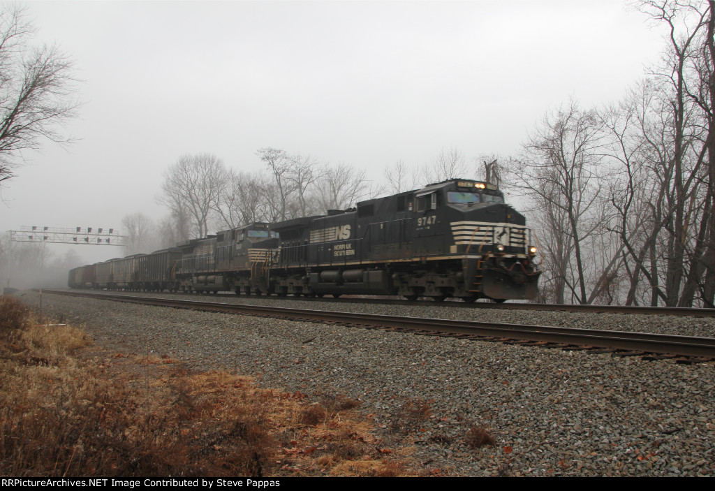 NS 9747 leads a coal train east through MP 116